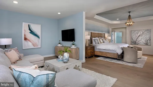 a bedroom with a bed and glass wall