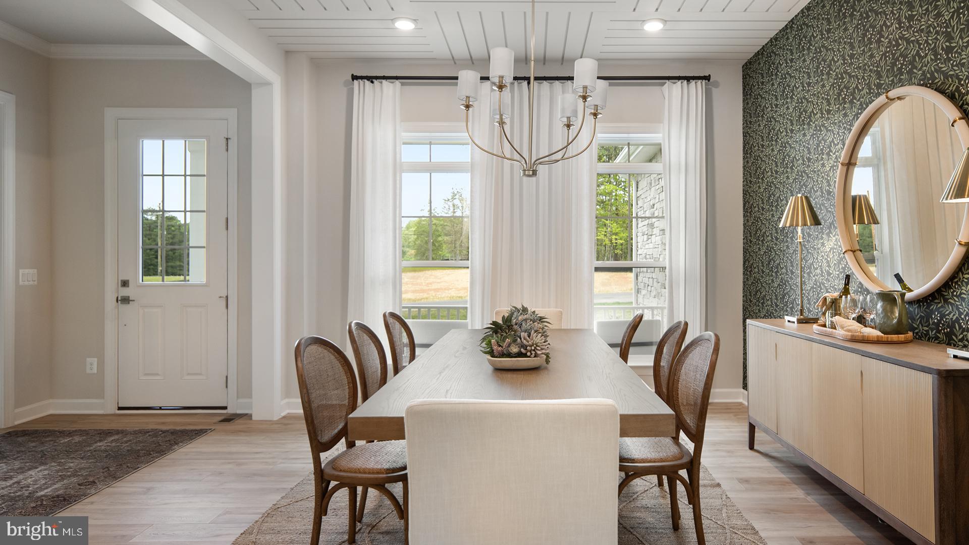 Tbb Tbb Ayers Court, Unit RICHMOND Fredericksburg, VA 22407 - Photo 27 of 106 a view of a dining room with furniture a chandelier and wooden floor