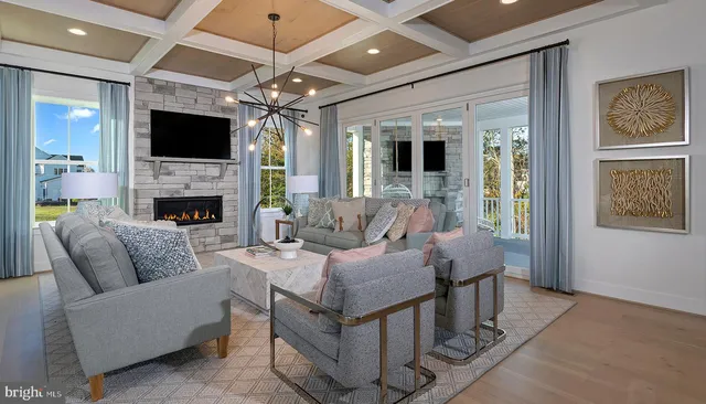 a living room with fireplace furniture a flat screen tv and a fireplace