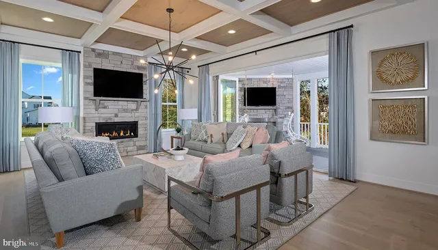 a living room with fireplace furniture and a flat screen tv