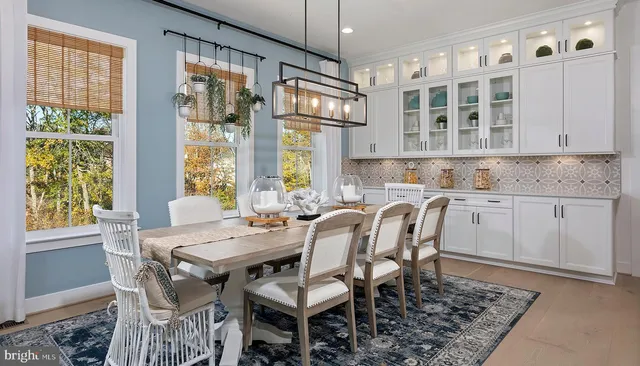 a view of a dining room with furniture window and outside view