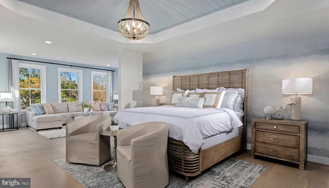 a bed room with a bed and a chandelier