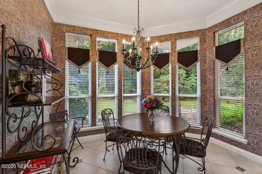 1483 Bridgette Way Fleming Island, FL 32003 - Photo 20 of 63 a view of a dining room with furniture window and outside view