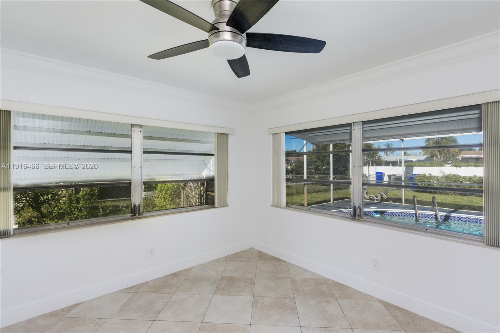 5425 Madison Street Hollywood, FL 33021 - Photo 12 of 45 a view of an empty room with a window and kitchen view