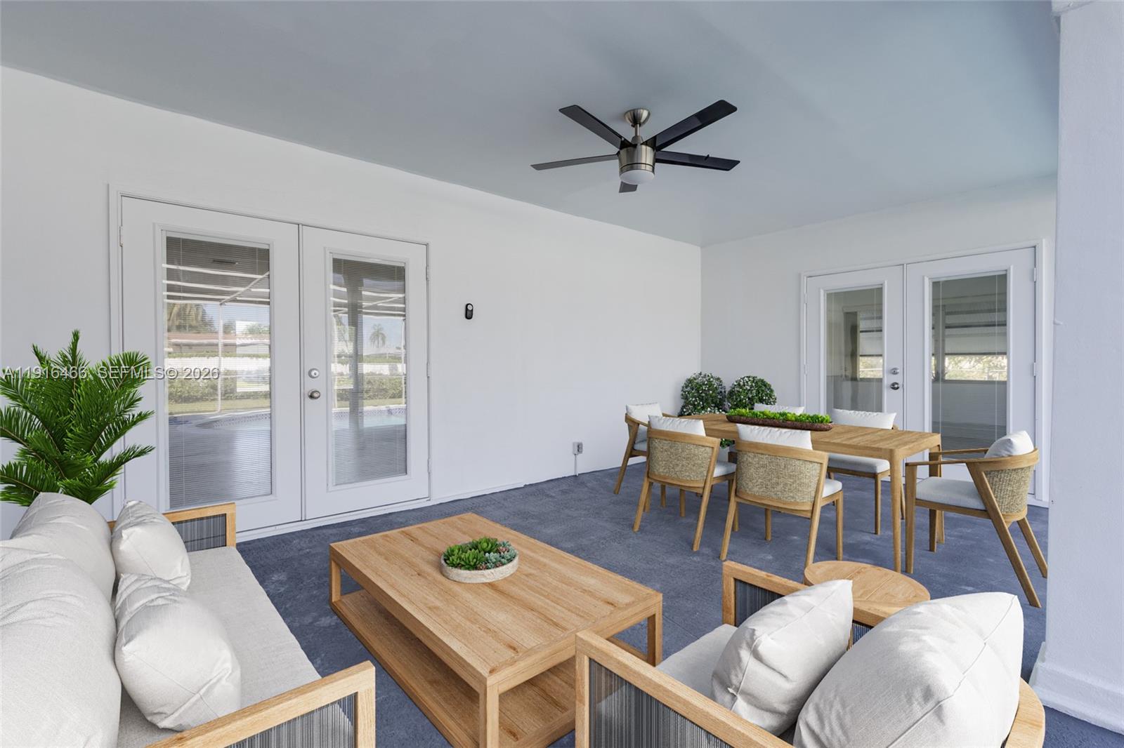 5425 Madison Street Hollywood, FL 33021 - Photo 2 of 45 a living room with furniture a dining table and a potted plant