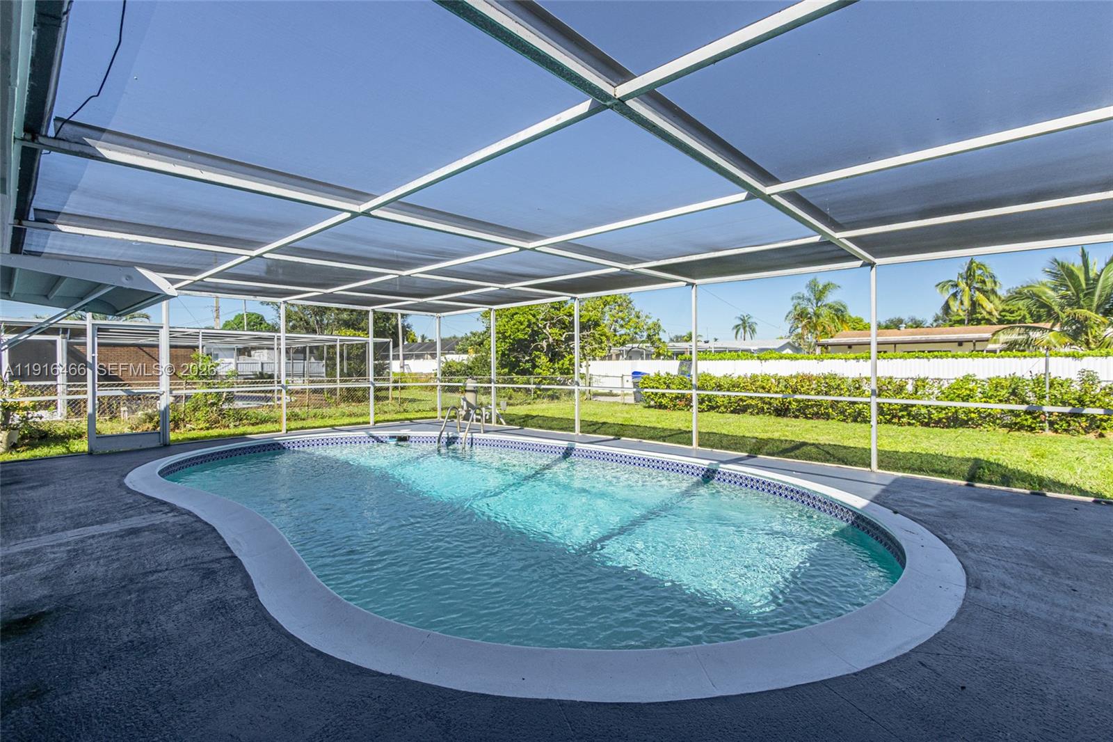 5425 Madison Street Hollywood, FL 33021 - Photo 29 of 45 a view of a swimming pool with an outdoor space