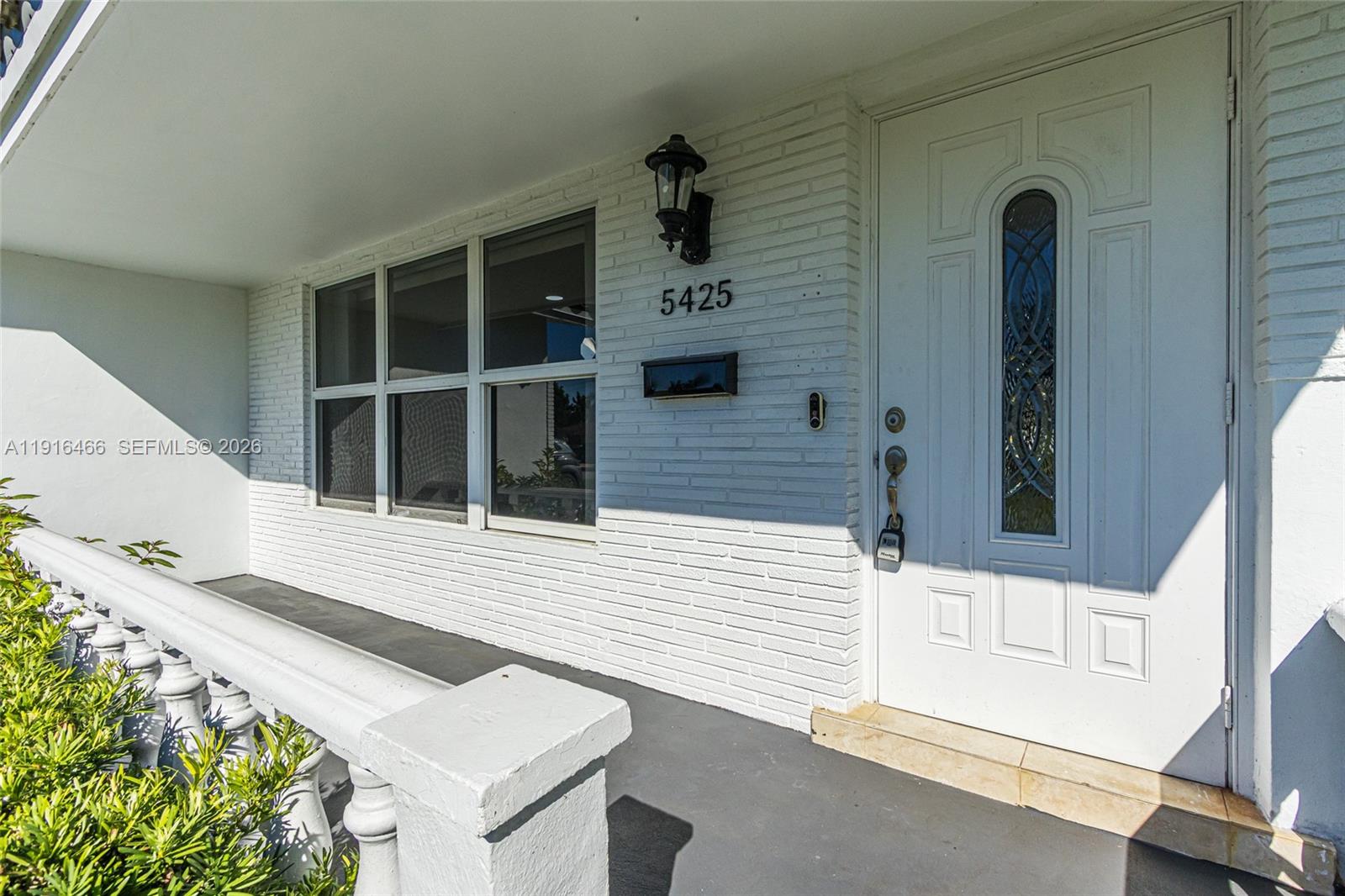 5425 Madison Street Hollywood, FL 33021 - Photo 4 of 45 front view of a house with a window