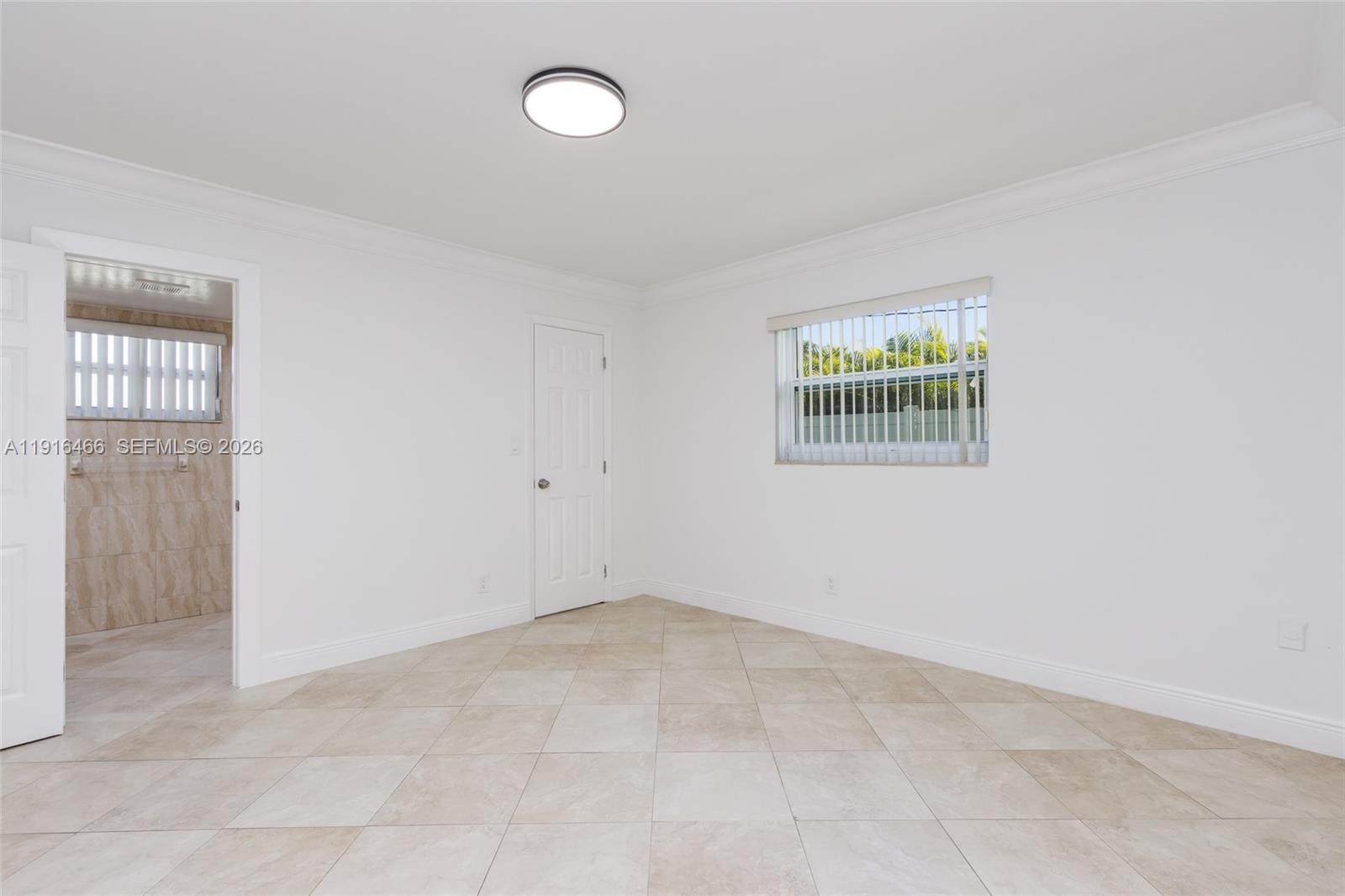 5425 Madison Street Hollywood, FL 33021 - Photo 43 of 45 an empty room with windows
