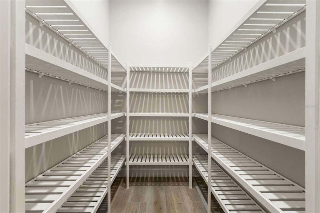 11081 Southwest 38th Boulevard Gainesville, FL 32608 - Photo 12 of 66 a view of a staircase with wooden floor and a floor to ceiling window