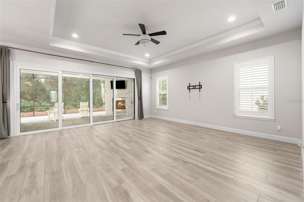 11081 Southwest 38th Boulevard Gainesville, FL 32608 - Photo 14 of 66 a view of an empty room with a window and a ceiling fan