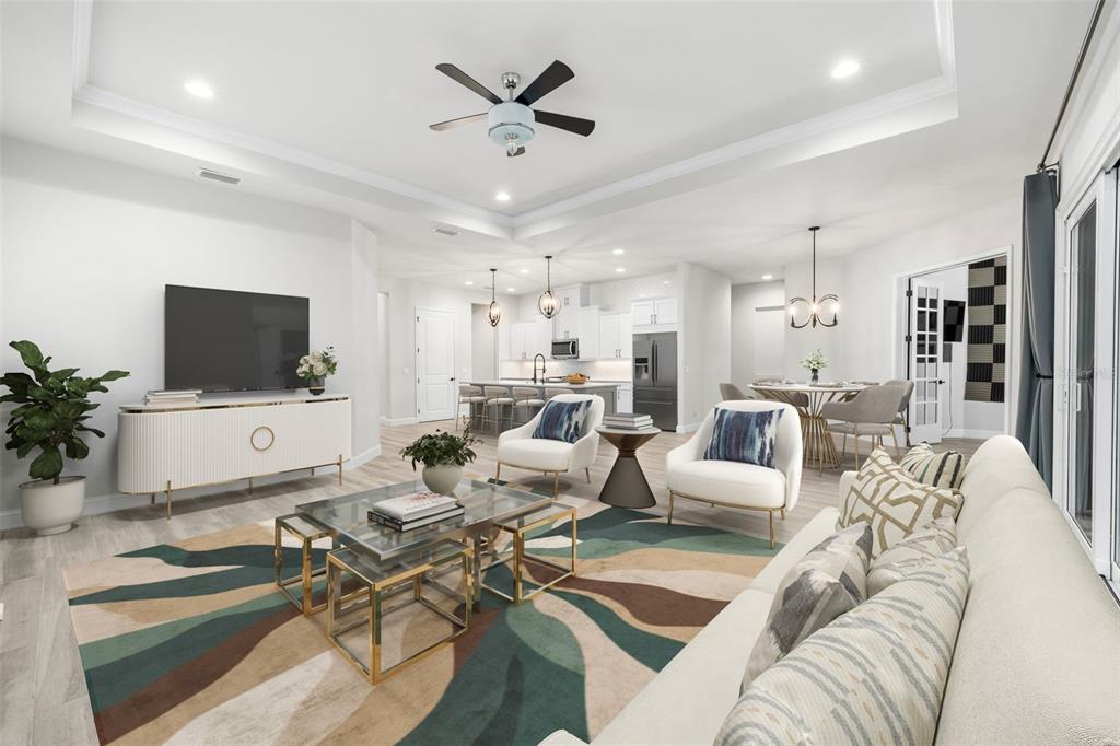 11081 Southwest 38th Boulevard Gainesville, FL 32608 - Photo 15 of 66 a living room with furniture kitchen view and a flat screen tv