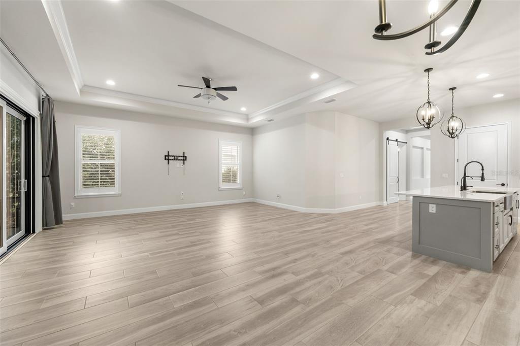 11081 Southwest 38th Boulevard Gainesville, FL 32608 - Photo 16 of 66 wooden floor in an empty room with a window