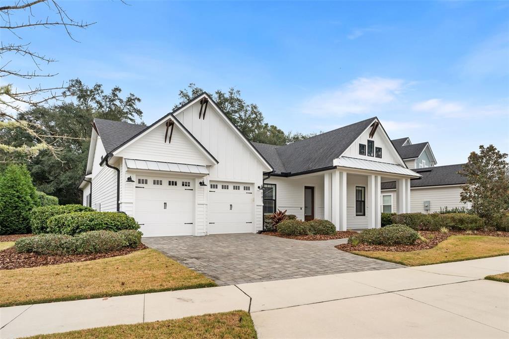 11081 Southwest 38th Boulevard Gainesville, FL 32608 - Photo 2 of 66 a view of a white house next to a yard and road