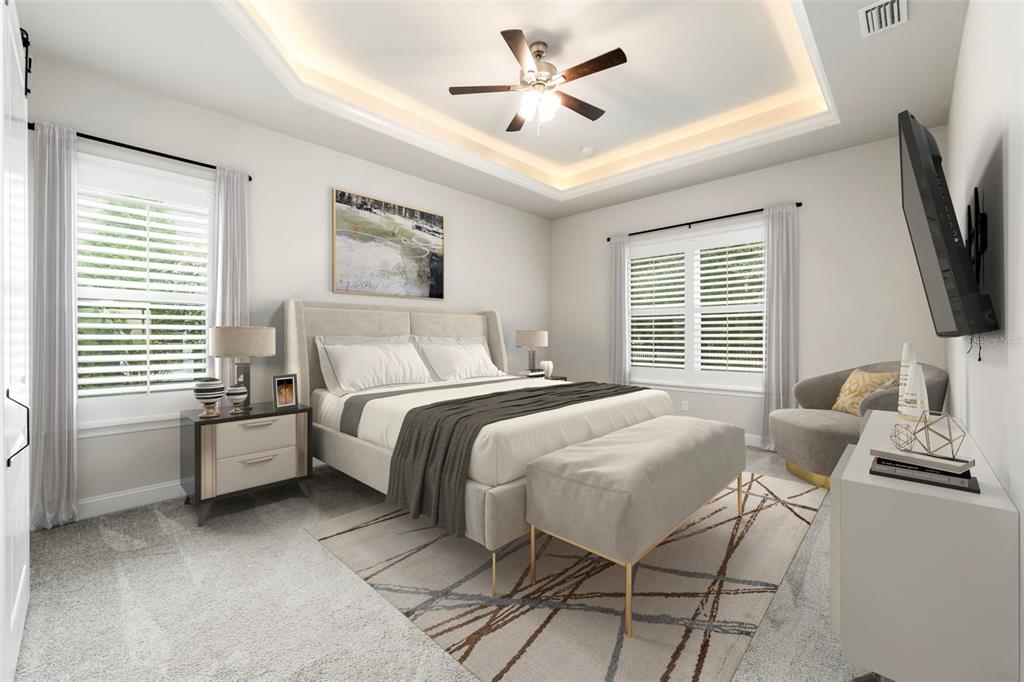 11081 Southwest 38th Boulevard Gainesville, FL 32608 - Photo 22 of 66 a bedroom with a bed and a flat screen tv