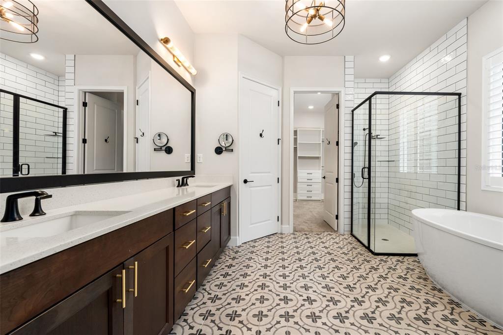 11081 Southwest 38th Boulevard Gainesville, FL 32608 - Photo 24 of 66 a bathroom with a sink a toilet and shower