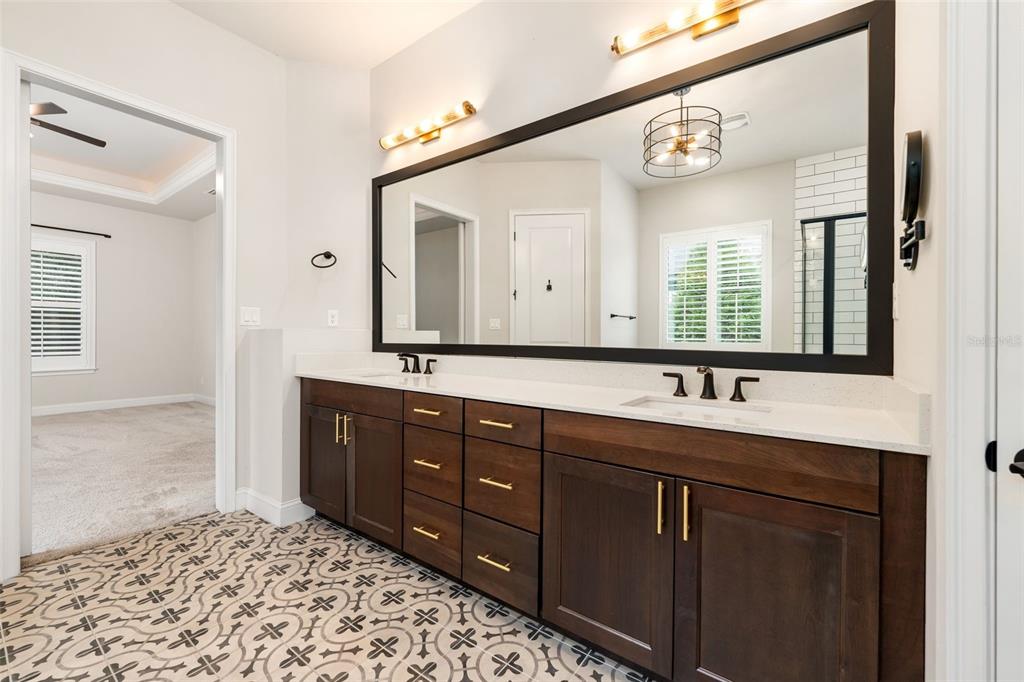 11081 Southwest 38th Boulevard Gainesville, FL 32608 - Photo 25 of 66 a bathroom with a sink and a mirror