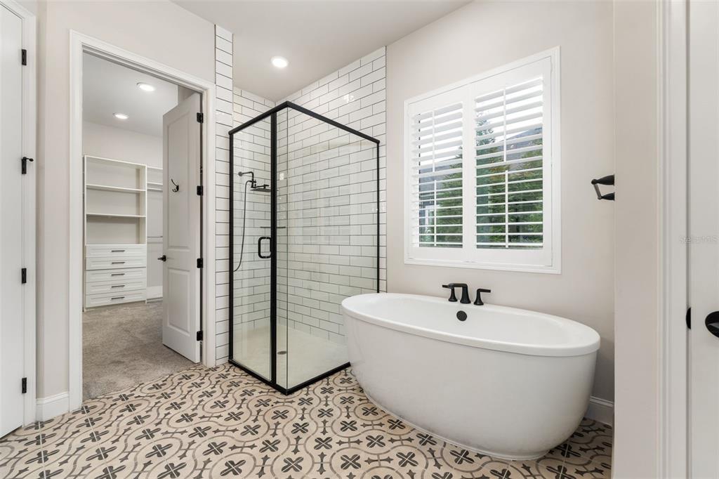 11081 Southwest 38th Boulevard Gainesville, FL 32608 - Photo 26 of 66 a bathroom with a bathtub and shower