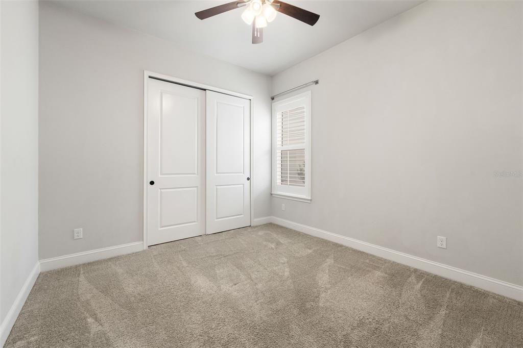 11081 Southwest 38th Boulevard Gainesville, FL 32608 - Photo 30 of 66 an empty room with chandelier fan