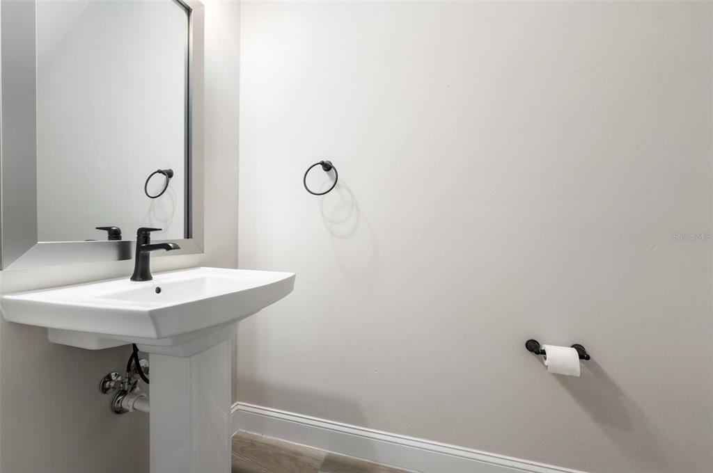 11081 Southwest 38th Boulevard Gainesville, FL 32608 - Photo 37 of 66 a bathroom with a sink and mirror