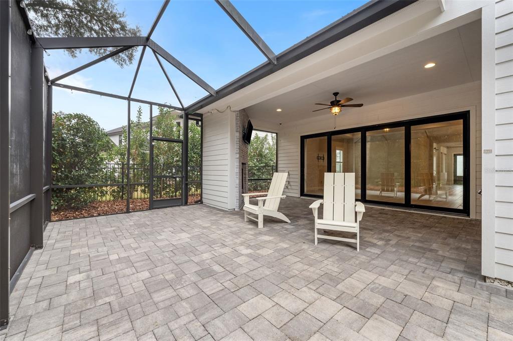 11081 Southwest 38th Boulevard Gainesville, FL 32608 - Photo 42 of 66 a view of a patio with a table and chairs under an umbrella