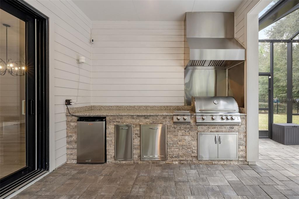 11081 Southwest 38th Boulevard Gainesville, FL 32608 - Photo 43 of 66 a kitchen with stainless steel appliances granite countertop a stove and a refrigerator