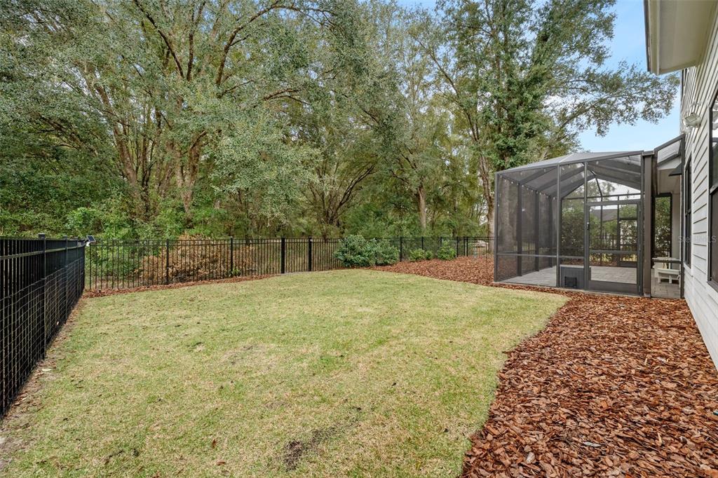 11081 Southwest 38th Boulevard Gainesville, FL 32608 - Photo 47 of 66 a house with trees in front of it
