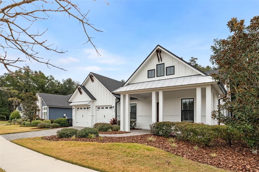 11081 Southwest 38th Boulevard Gainesville, FL 32608 - Photo 60 of 66 a front view of a house with garden