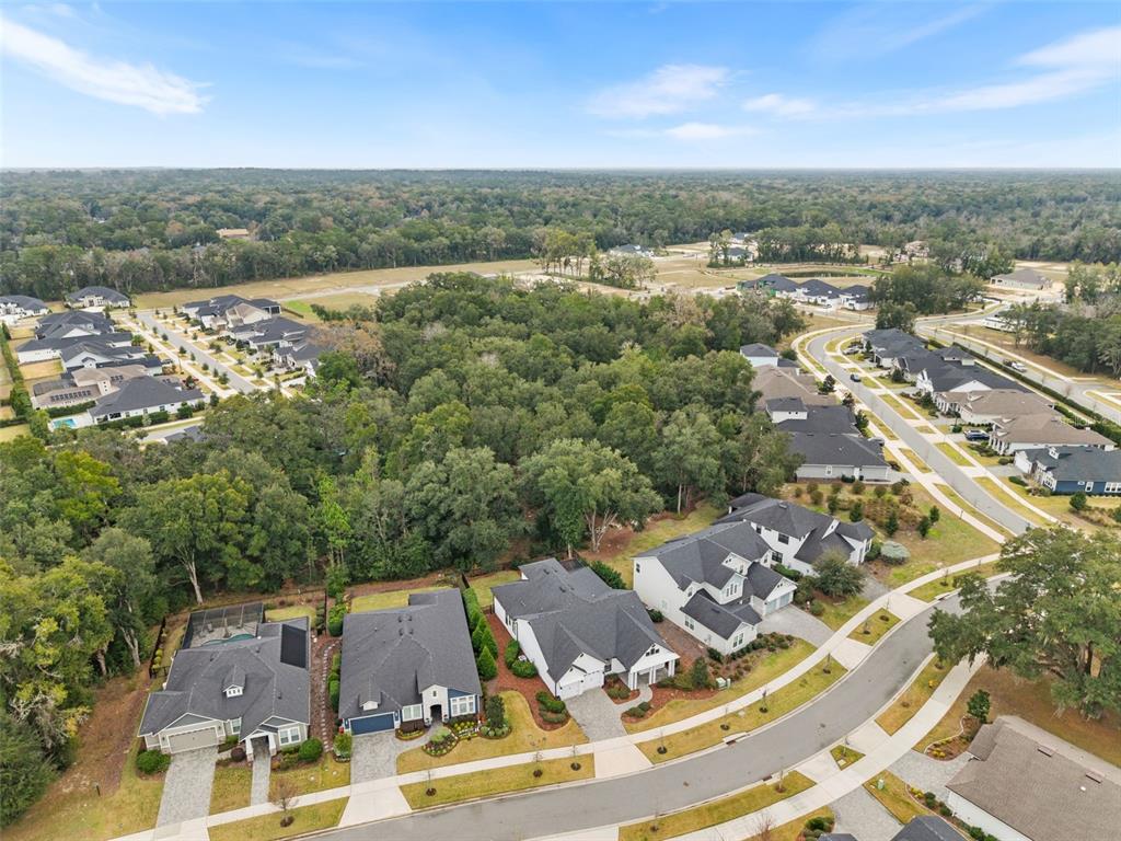 11081 Southwest 38th Boulevard Gainesville, FL 32608 - Photo 62 of 66 an aerial view of residential houses with outdoor space