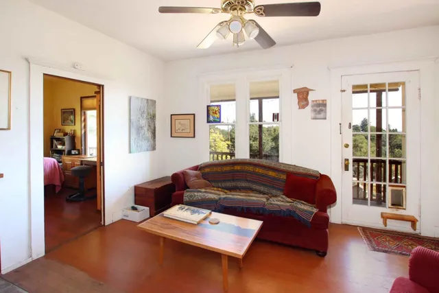 a dining room with furniture and wooden floor