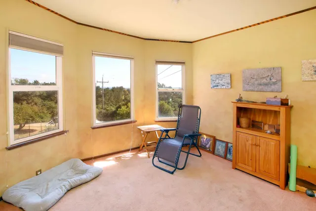 a work room with furniture and a bookshelf