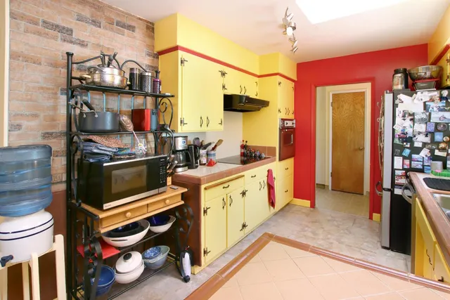 a view of a patio with table and chairs and potted plants