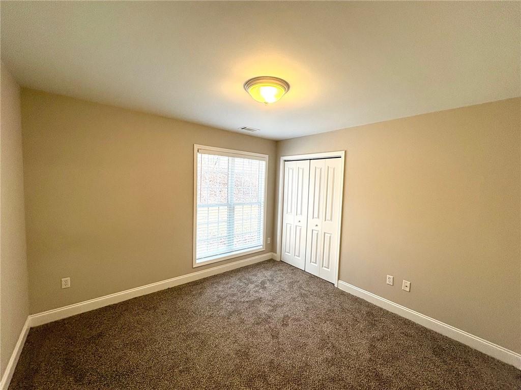 41 Oakmont Drive Southwest Rome, GA 30161 - Photo 11 of 21 an empty room with windows