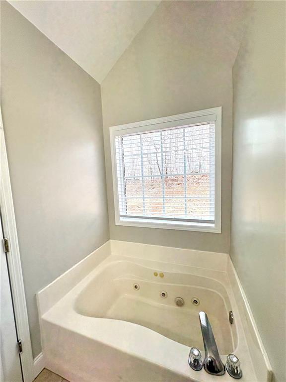 41 Oakmont Drive Southwest Rome, GA 30161 - Photo 14 of 21 a bath tub sitting in a bathroom next to a window