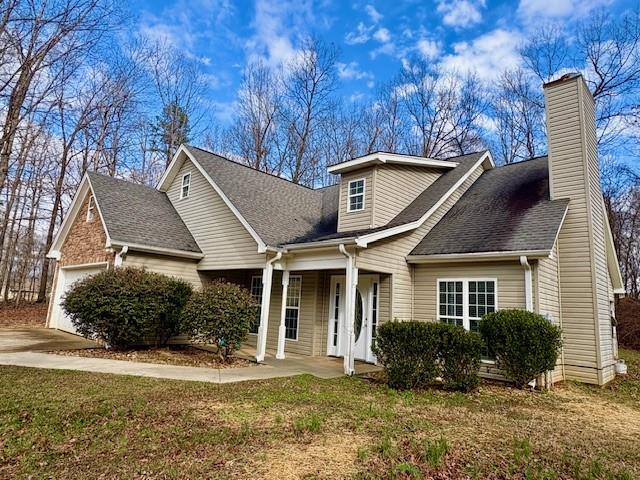 41 Oakmont Drive Southwest Rome, GA 30161 - Photo 2 of 21 a front view of a house with a yard and garage