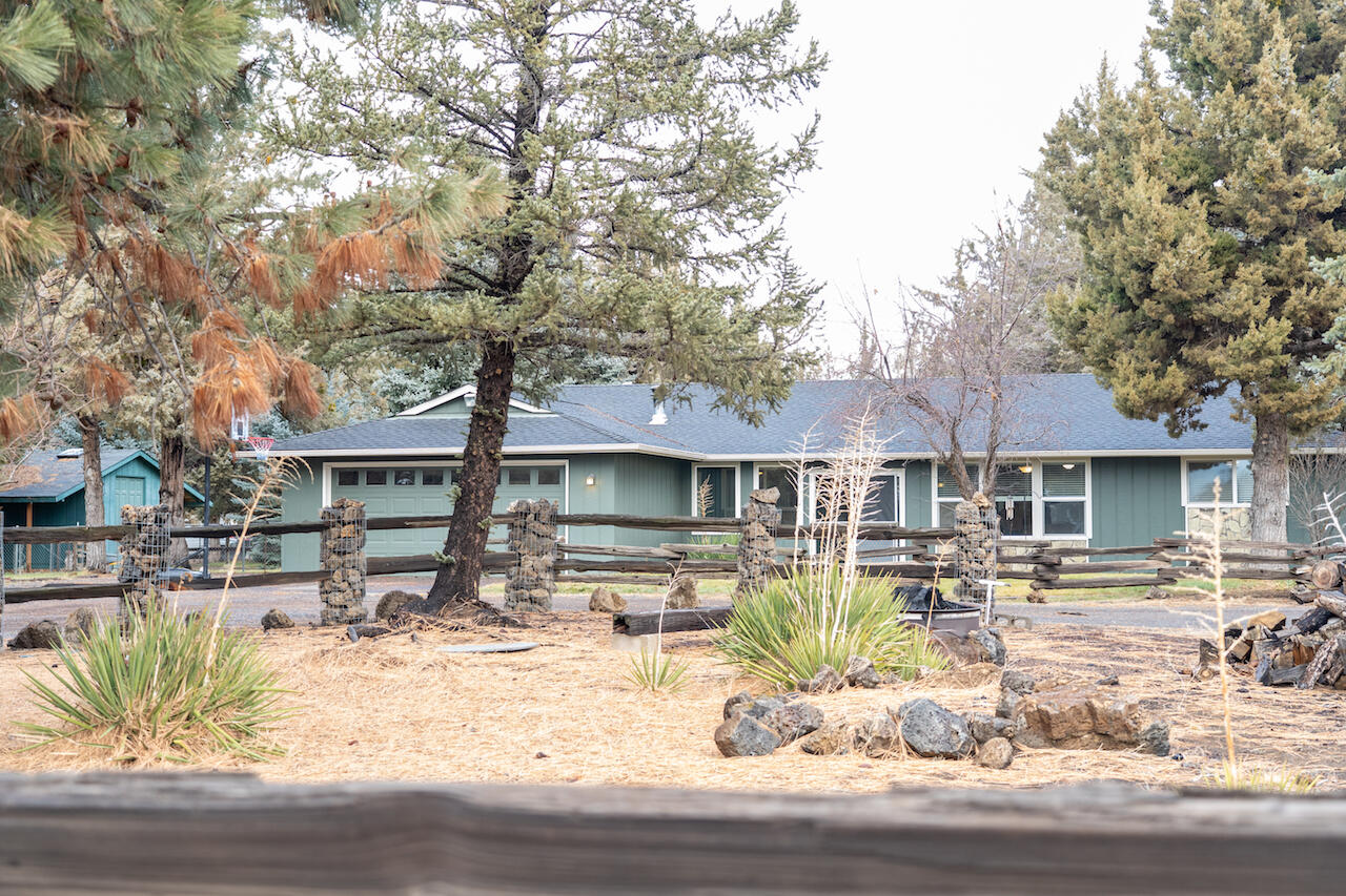 63410 Hamehook Road Bend, OR 97701 - Photo 5 of 35 a front view of a house with swimming pool