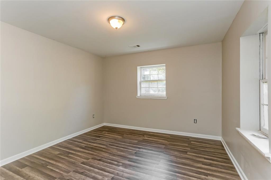 4179 Williamson Road Ellenwood, GA 30294 - Photo 17 of 25 a view of a room with wooden floor and white walls