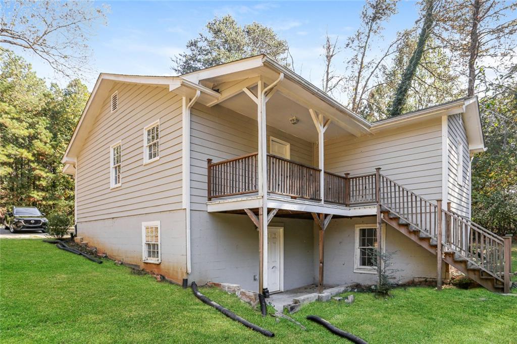 4179 Williamson Road Ellenwood, GA 30294 - Photo 21 of 25 a view of a house with a yard