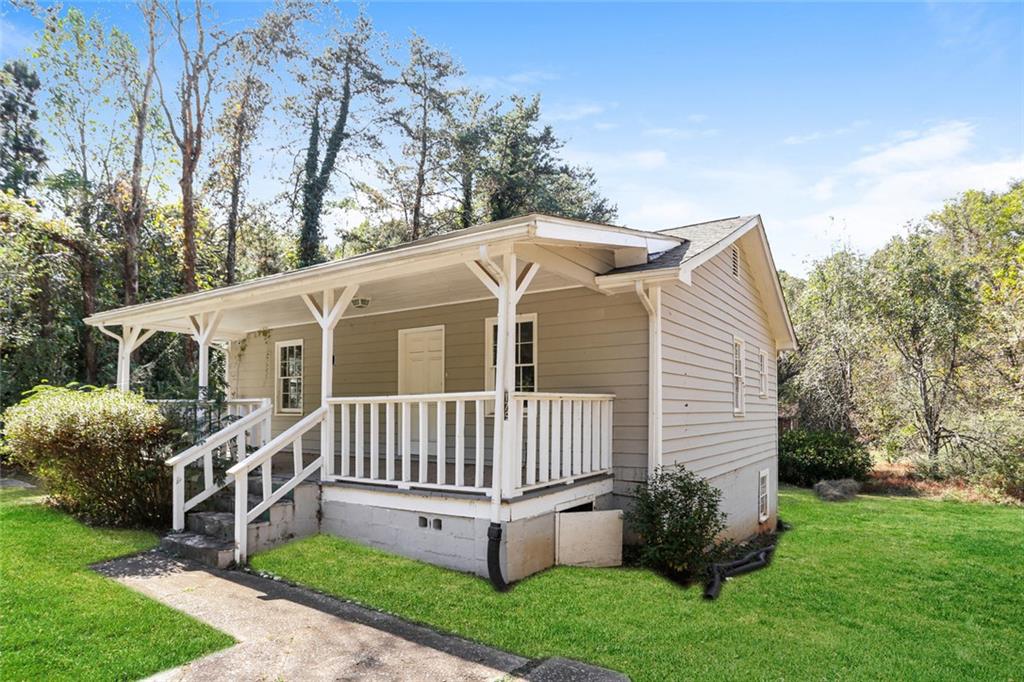 4179 Williamson Road Ellenwood, GA 30294 - Photo 3 of 25 a view of a house with a yard and deck