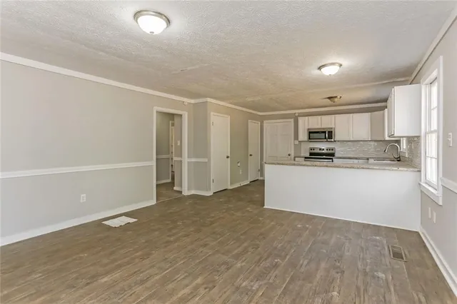 a view of kitchen with wooden floor
