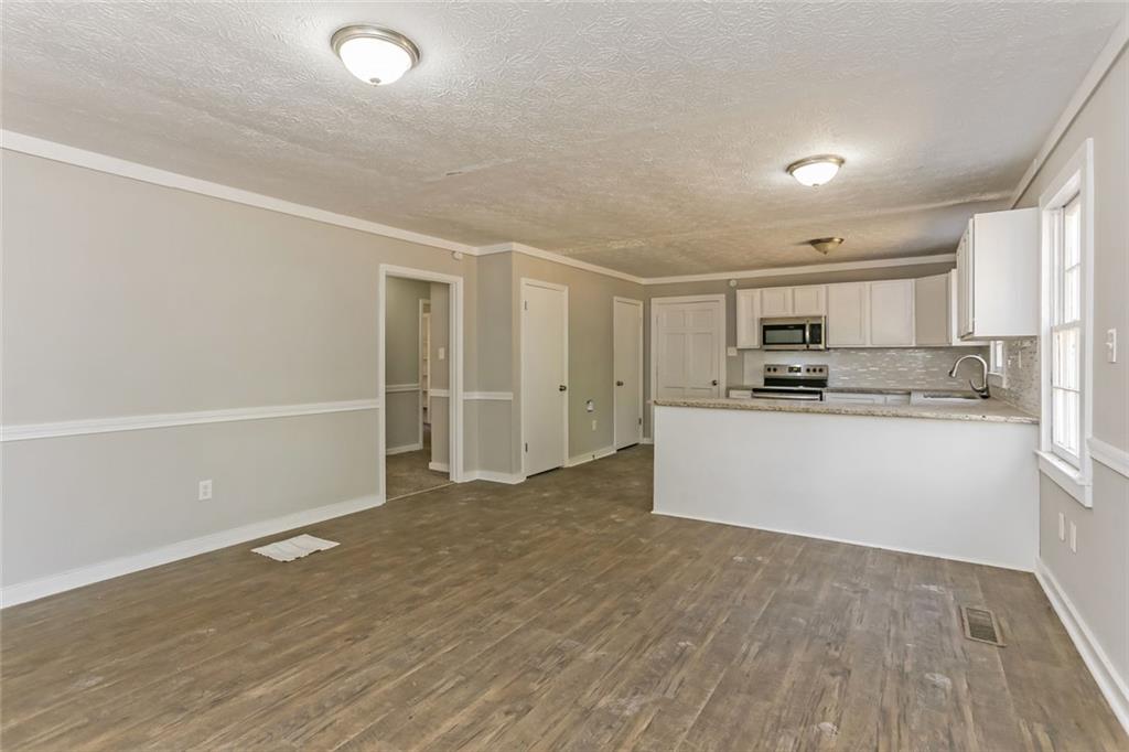 4179 Williamson Road Ellenwood, GA 30294 - Photo 4 of 25 a view of kitchen with wooden floor