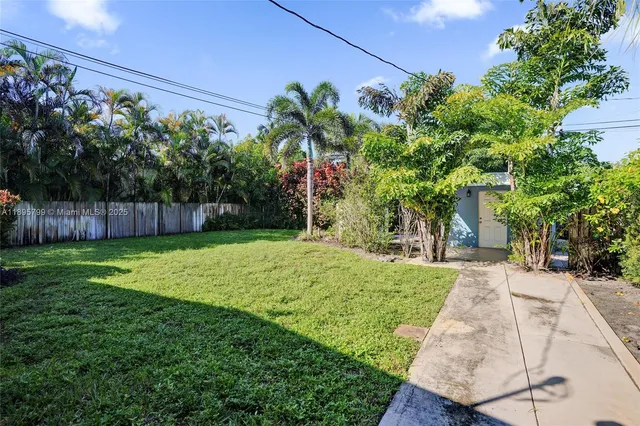 a view of a backyard with a garden