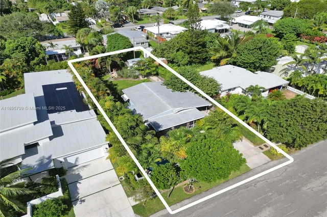 an aerial view of house with yard