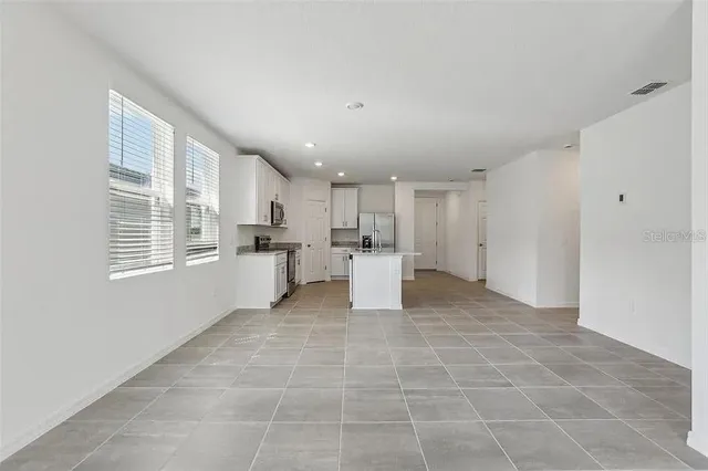 a big room with windows and closet