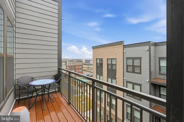 a view of a balcony with chairs