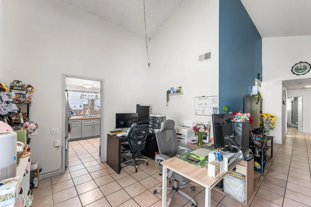 a view of a workspace with furniture