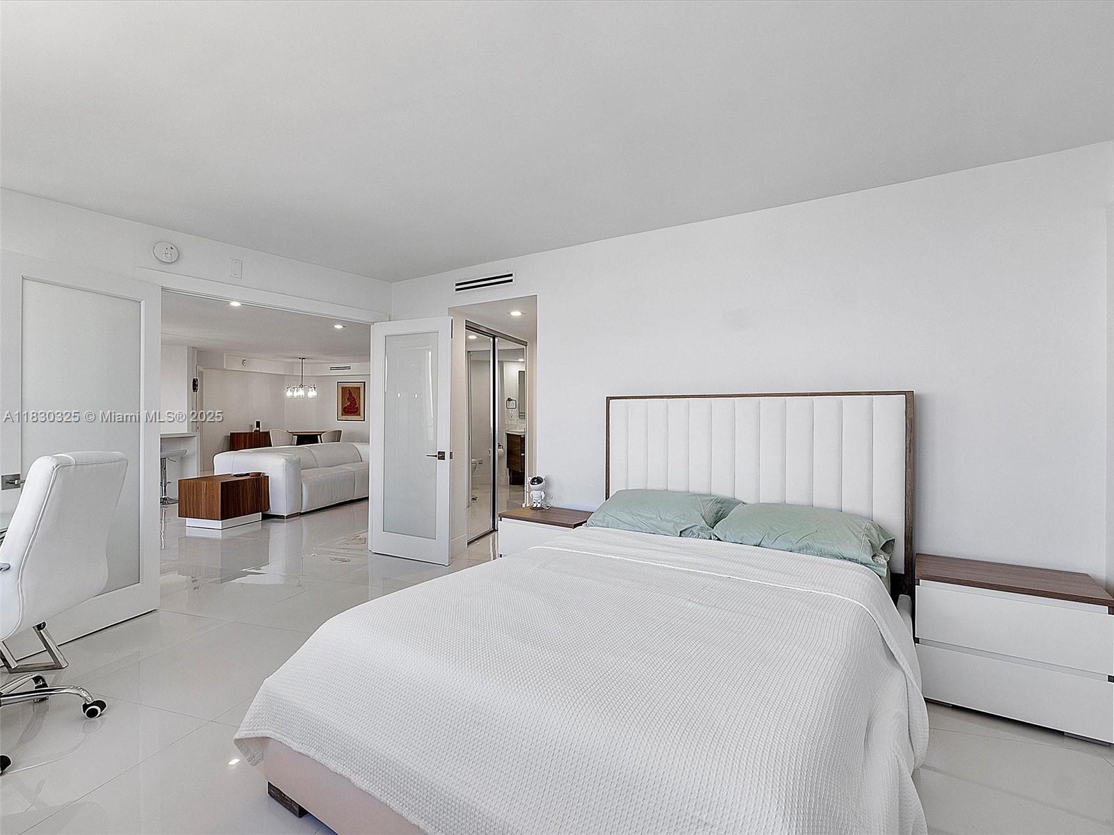 550 South Ocean Boulevard, Unit 1509 Boca Raton, FL 33432 - Photo 22 of 52 a large white bed in a white room