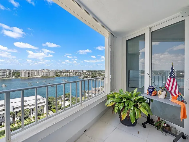 a view of a balcony with outdoor seating