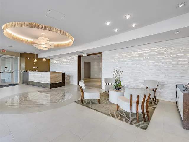 a view of a living room and entryway