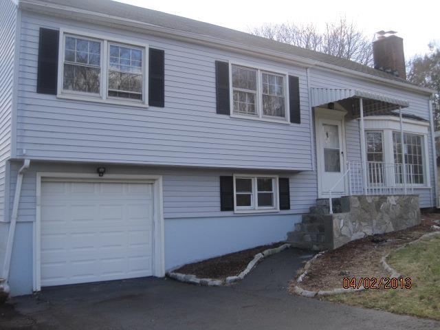 39 Corbin Road Hamden, CT 06517 - Photo 1 of 1 a front view of a house with a garage