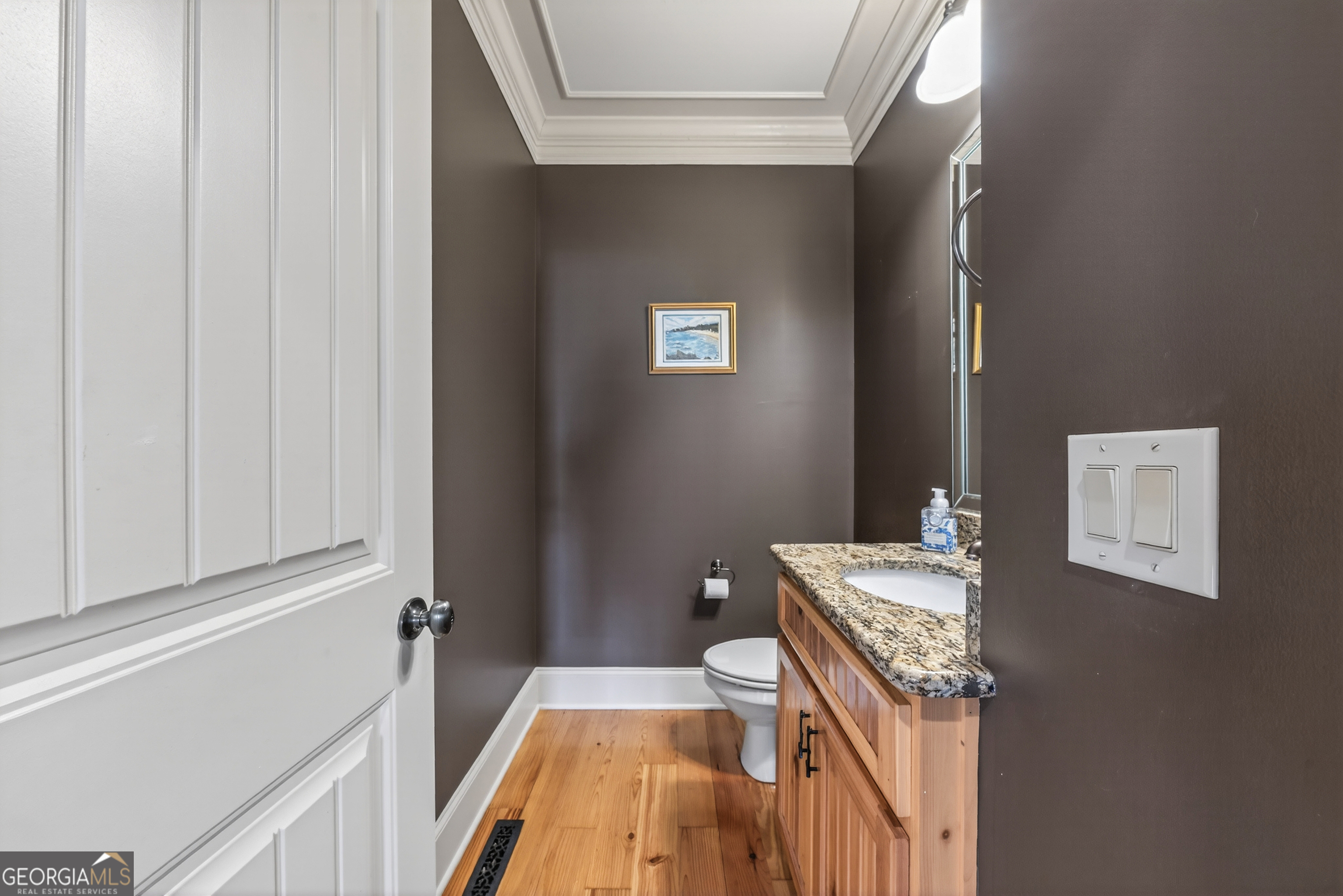 1000 Boxwood Place Madison, GA 30650 - Photo 29 of 75 a bathroom with a sink and a mirror